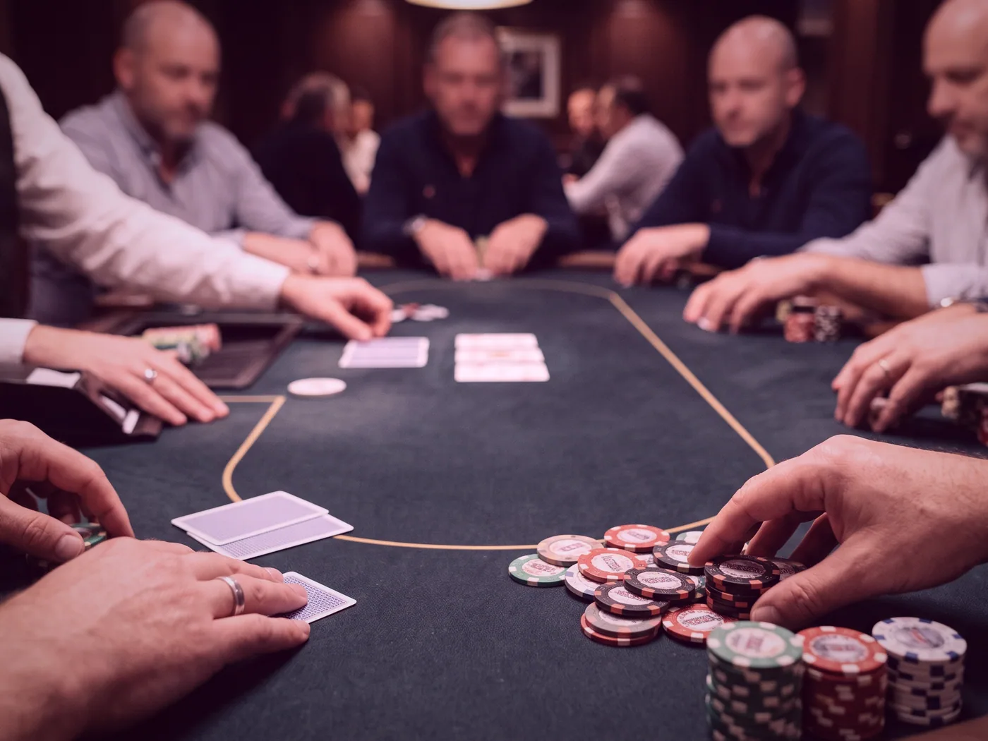A single card table laid with chip trays and a fresh deck, set before the tables open.